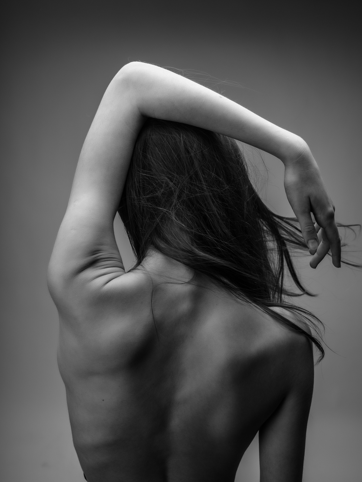 Back of a Woman Naked Body Posing Black and White Photo